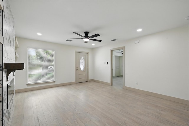 2614 E Mitchell St, Arlington, TX 76010 - unfurnished living room with a ceiling fan, light wood-style floors, recessed lighting, and baseboards