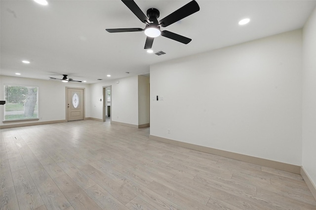 2614 E Mitchell St, Arlington, TX 76010 - unfurnished living room with ceiling fan, recessed lighting, light wood-style floors, and baseboards