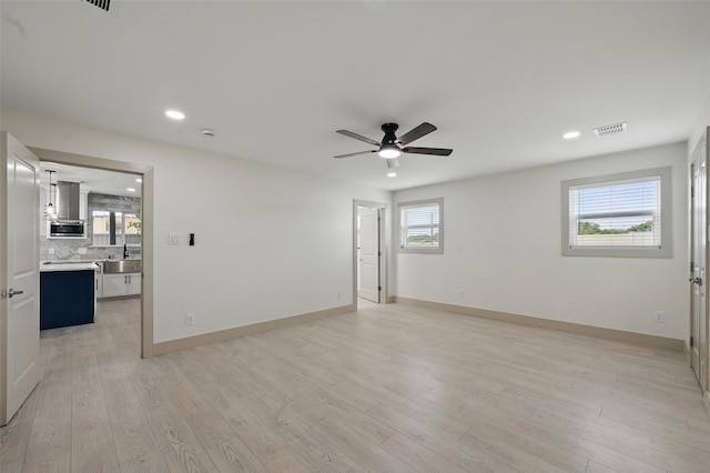 2614 E Mitchell St, Arlington, TX 76010 - empty room with a sink, recessed lighting, ceiling fan, light wood-type flooring, and baseboards