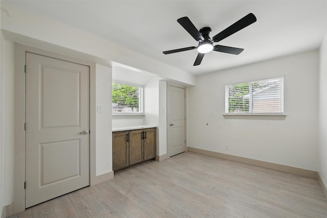 2614 E Mitchell St, Arlington, TX 76010 - unfurnished bedroom with light wood-type flooring, baseboards, and ceiling fan