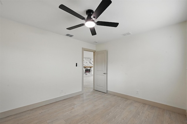 2614 E Mitchell St, Arlington, TX 76010 - empty room with a ceiling fan, light wood-type flooring, and baseboards