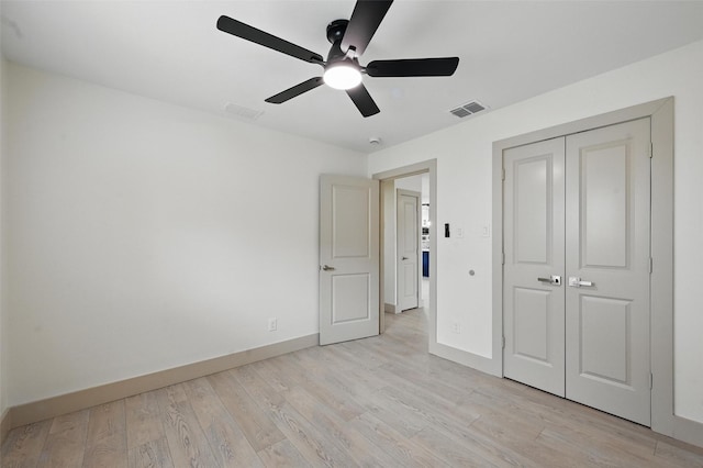 2614 E Mitchell St, Arlington, TX 76010 - unfurnished bedroom with baseboards, light wood-type flooring, a closet, and a ceiling fan