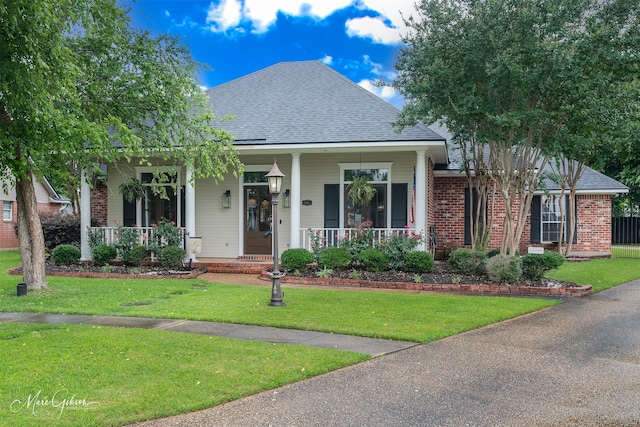 9406 Prestonwood Cir, Shreveport, LA 71115 - view of front facade featuring roof with shingles, brick siding, and covered porch