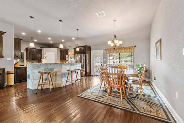 225 County Road 3525, Paradise, TX 76073 - dining space with dark wood-style flooring, a chandelier, baseboards, a textured wall, and recessed lighting