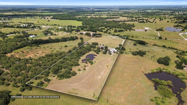 225 County Road 3525, Paradise, TX 76073 - aerial view of property's location featuring property boundaries highlighted, a nearby body of water, and rural landscape