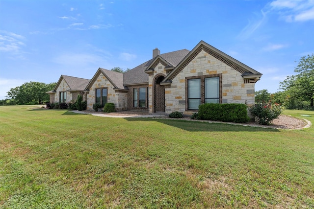 225 County Road 3525, Paradise, TX 76073 - french country home featuring stone siding, a chimney, and a front lawn