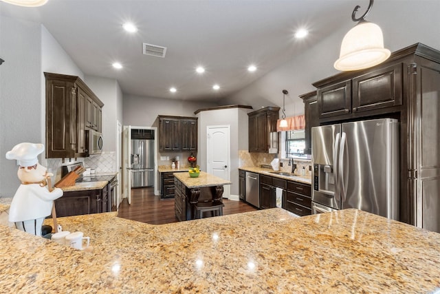 225 County Road 3525, Paradise, TX 76073 - kitchen featuring appliances with stainless steel finishes, a sink, dark wood-type flooring, dark brown cabinetry, and tasteful backsplash