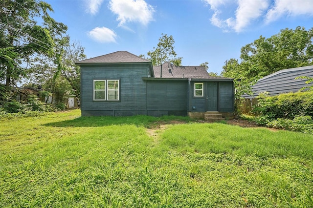 210 N 5th Ave, Denison, TX 75021 - rear view of property featuring entry steps