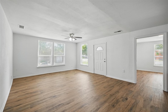 210 N 5th Ave, Denison, TX 75021 - entryway with ceiling fan, wood finished floors, and baseboards