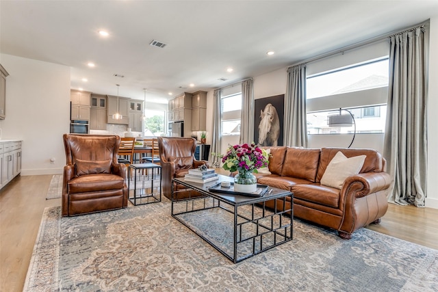 8120 Radnor Rd, Dallas, TX 75231 - living room featuring light wood-style flooring, recessed lighting, and baseboards