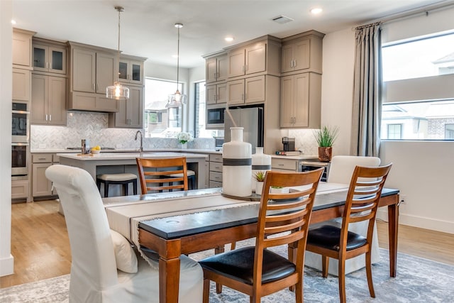 8120 Radnor Rd, Dallas, TX 75231 - dining room featuring light wood-type flooring, recessed lighting, and baseboards