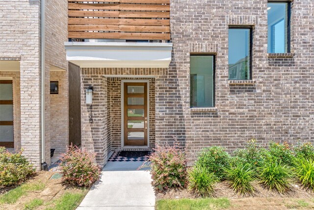 8120 Radnor Rd, Dallas, TX 75231 - doorway to property with brick siding
