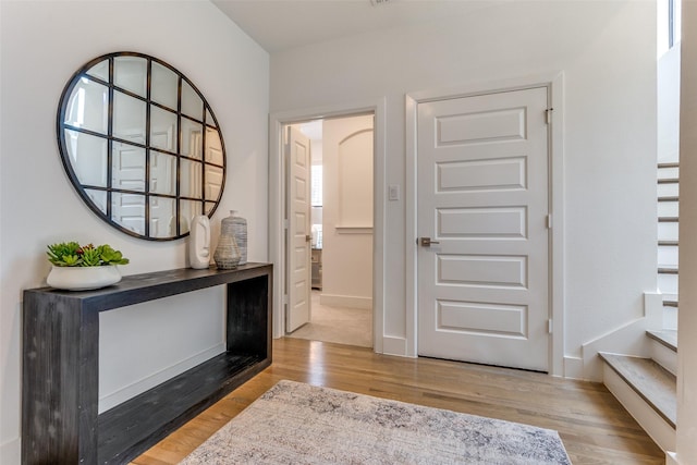 8120 Radnor Rd, Dallas, TX 75231 - entryway featuring wood finished floors, stairway, and baseboards