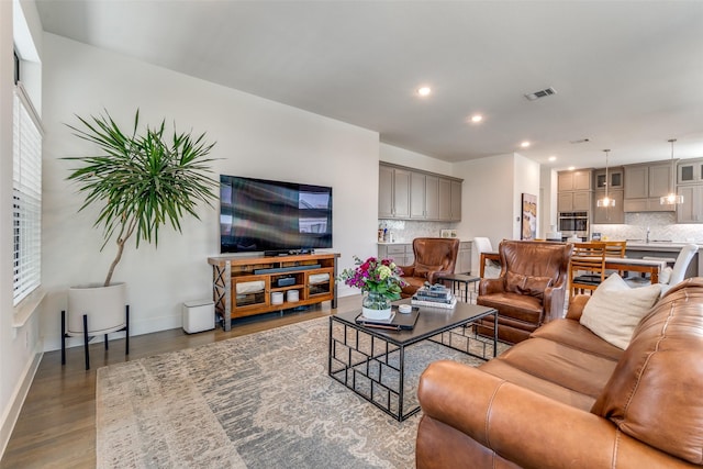 8120 Radnor Rd, Dallas, TX 75231 - living room with wood finished floors, recessed lighting, and baseboards