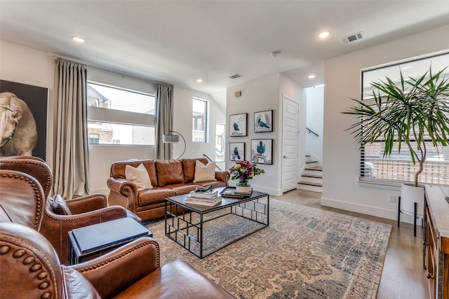 8120 Radnor Rd, Dallas, TX 75231 - living room with stairway, wood finished floors, recessed lighting, and baseboards