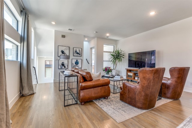8120 Radnor Rd, Dallas, TX 75231 - living room with light wood-type flooring, recessed lighting, and baseboards