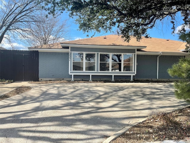 12331 Ferris Creek Ln, Dallas, TX 75243 - rear view of property with brick siding, roof with shingles, and crawl space
