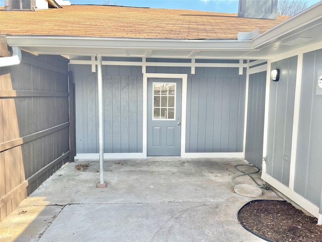 12331 Ferris Creek Ln, Dallas, TX 75243 - entrance to property featuring roof with shingles and a patio area