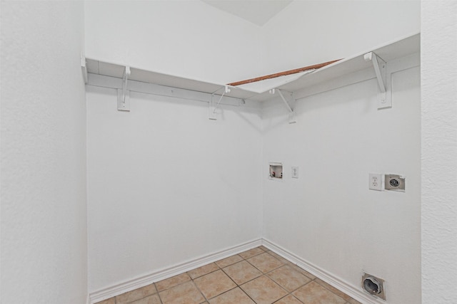 1301 Hennessey Ct, Fort Worth, TX 76131 - laundry area featuring hookup for an electric dryer, washer hookup, light tile patterned floors, and baseboards