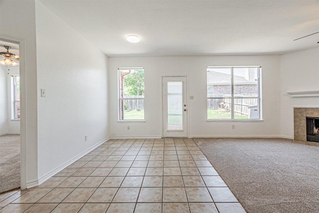 1301 Hennessey Ct, Fort Worth, TX 76131 - unfurnished living room with ceiling fan, plenty of natural light, and a fireplace