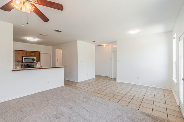 1301 Hennessey Ct, Fort Worth, TX 76131 - unfurnished living room with ceiling fan, light tile patterned floors, baseboards, and a sink