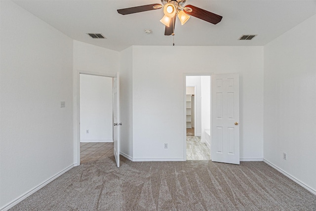 1301 Hennessey Ct, Fort Worth, TX 76131 - unfurnished bedroom featuring carpet floors, a spacious closet, baseboards, and a ceiling fan