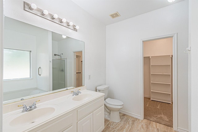 1301 Hennessey Ct, Fort Worth, TX 76131 - bathroom featuring a stall shower, a garden tub, toilet, a spacious closet, and double vanity