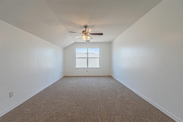 1301 Hennessey Ct, Fort Worth, TX 76131 - empty room featuring a ceiling fan, light colored carpet, baseboards, and vaulted ceiling