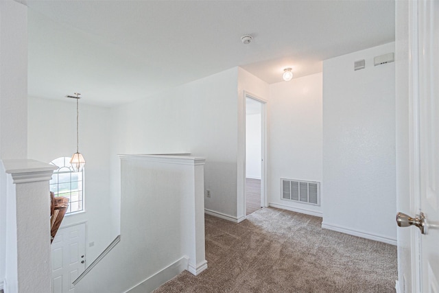 1301 Hennessey Ct, Fort Worth, TX 76131 - hallway featuring an upstairs landing, carpet floors, baseboards, and a chandelier