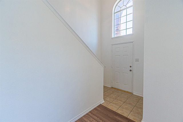 1301 Hennessey Ct, Fort Worth, TX 76131 - entryway featuring baseboards, stairs, and light wood-type flooring