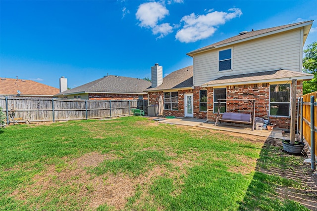 1301 Hennessey Ct, Fort Worth, TX 76131 - rear view of property with a patio, brick siding, and a chimney
