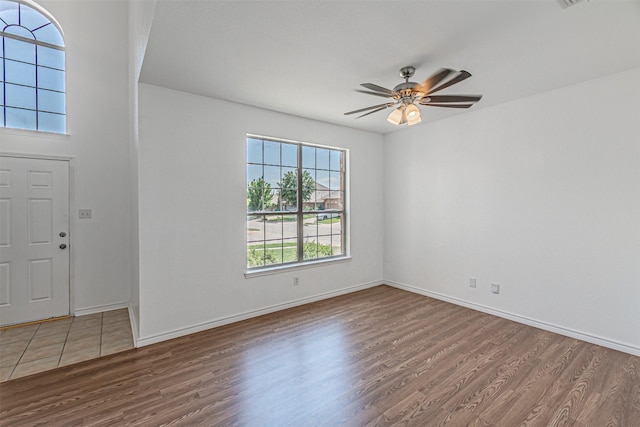 1301 Hennessey Ct, Fort Worth, TX 76131 - foyer featuring wood finished floors, ceiling fan, and baseboards