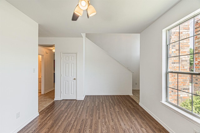 1301 Hennessey Ct, Fort Worth, TX 76131 - additional living space featuring wood finished floors, a ceiling fan, and baseboards