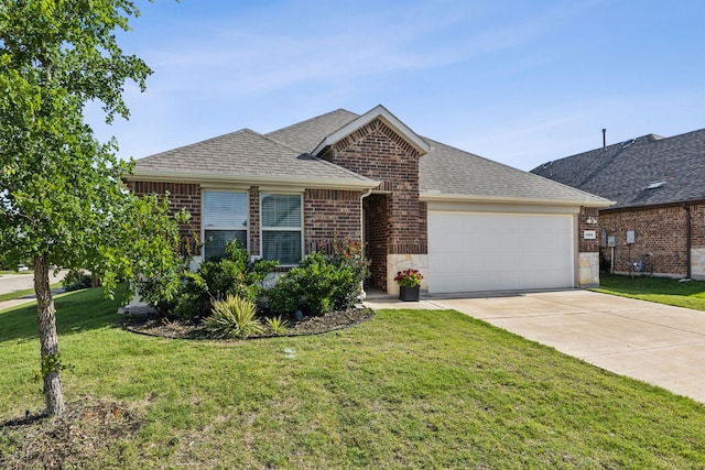 1104 Egret Way, Celina, TX 75009 - view of front facade featuring an attached garage, brick siding, driveway, a front lawn, and a shingled roof