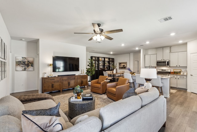 1104 Egret Way, Celina, TX 75009 - living room with recessed lighting, a ceiling fan, and light wood-type flooring