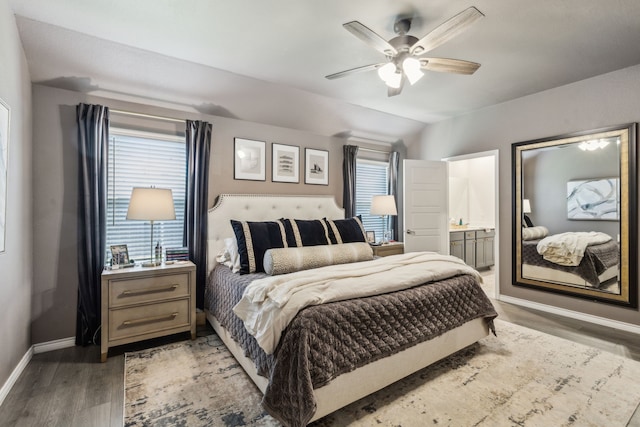 1104 Egret Way, Celina, TX 75009 - bedroom featuring baseboards, light wood finished floors, vaulted ceiling, ensuite bath, and ceiling fan