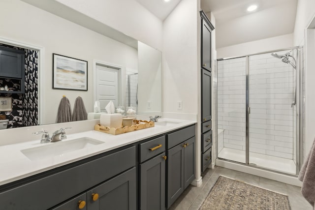 1104 Egret Way, Celina, TX 75009 - bathroom featuring a shower stall, double vanity, tile patterned floors, and recessed lighting