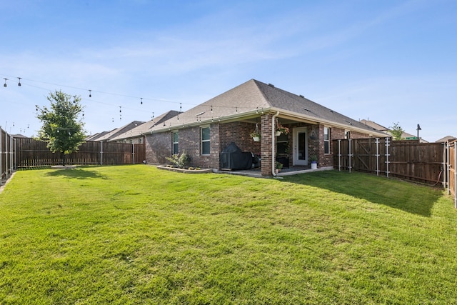1104 Egret Way, Celina, TX 75009 - rear view of property featuring brick siding, a patio, and a shingled roof