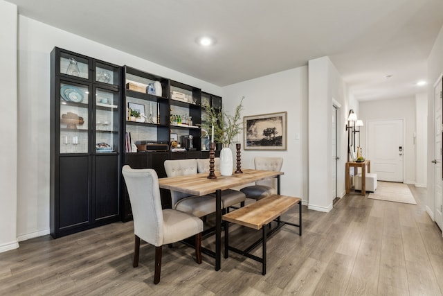 1104 Egret Way, Celina, TX 75009 - dining space with wood finished floors, baseboards, and recessed lighting
