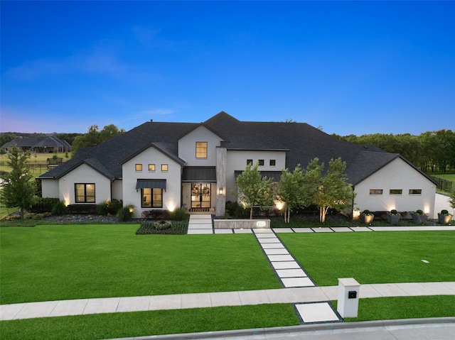 4155 American Pharoah Way, Celina, TX 75009 - view of front of house with a front yard, a shingled roof, and stucco siding