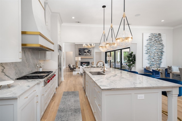 4155 American Pharoah Way, Celina, TX 75009 - kitchen featuring a sink, ornamental molding, stainless steel appliances, a large island, and white cabinetry
