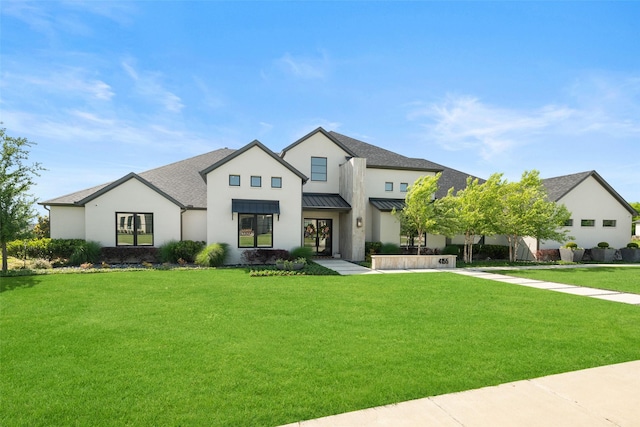 4155 American Pharoah Way, Celina, TX 75009 - modern farmhouse with a standing seam roof, a front yard, roof with shingles, and stucco siding