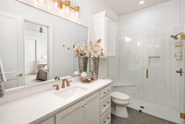 4155 American Pharoah Way, Celina, TX 75009 - full bath featuring vanity, toilet, a shower stall, tile patterned floors, and ensuite bath