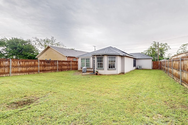 2613 Rochester St, Dallas, TX 75215 - back of property with a shingled roof and cooling unit