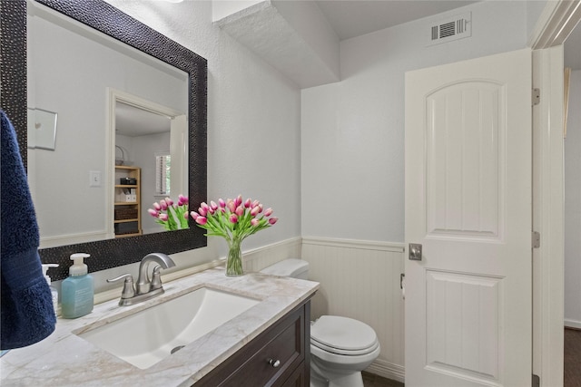 10420 Carry Back Cir, Dallas, TX 75229 - bathroom with vanity and wainscoting