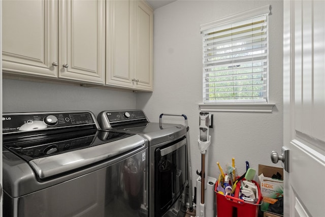 10420 Carry Back Cir, Dallas, TX 75229 - laundry room featuring washing machine and clothes dryer and cabinet space