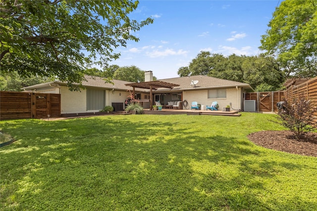 10420 Carry Back Cir, Dallas, TX 75229 - back of property with a fenced backyard, a chimney, a wooden deck, and brick siding