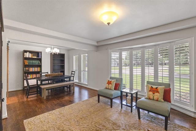 10420 Carry Back Cir, Dallas, TX 75229 - sitting room with a chandelier and wood finished floors