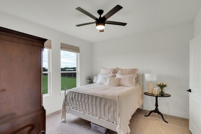 219 Mulkey Rd, Waxahachie, TX 75167 - bedroom with light colored carpet, baseboards, and ceiling fan