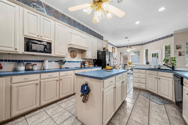 4215 Green Oak Dr, Waco, TX 76710 - kitchen featuring a ceiling fan, a sink, dark countertops, black appliances, and ornamental molding